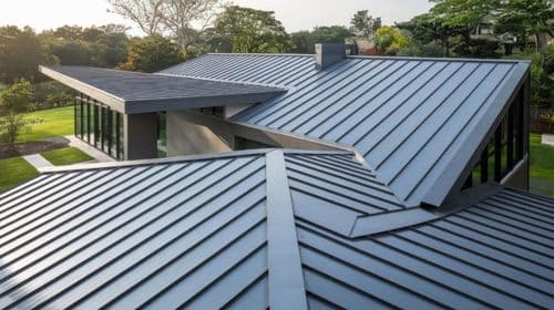 Aerial view of modern home with metal roof - storm damage blog
